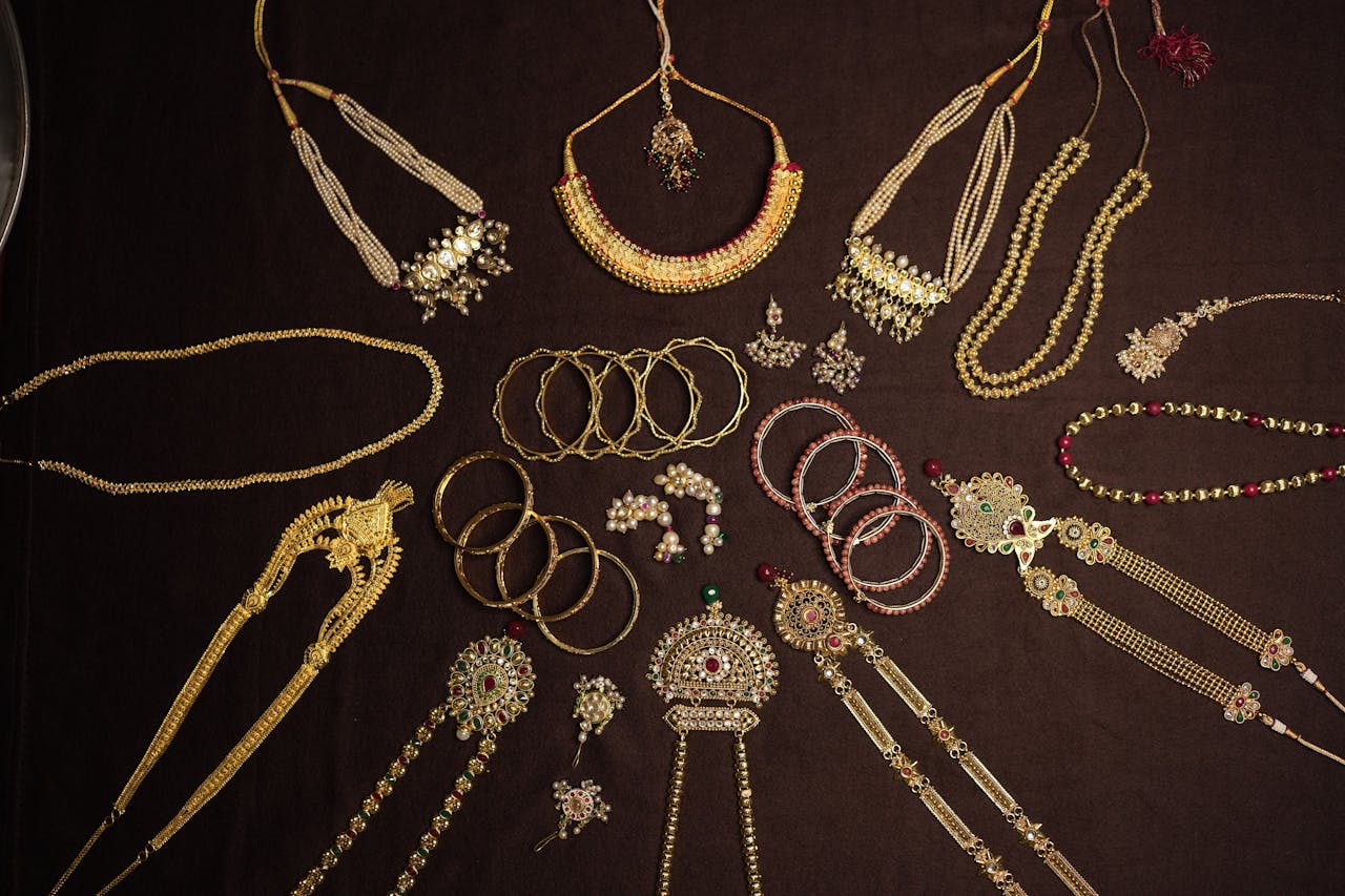 An exquisite display of traditional Indian jewelry including necklaces, bangles, and earrings.